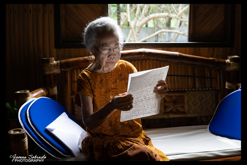 Filipino American Lola reading Letter from California: Baybay, Aklan, Philippines